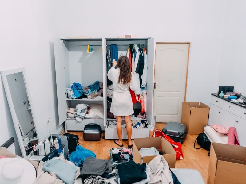 A woman decluttering her home before moving