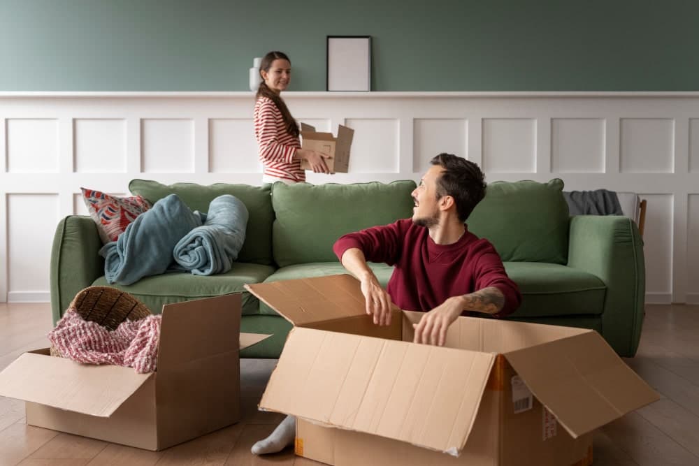 Couple packing for their midweek house move