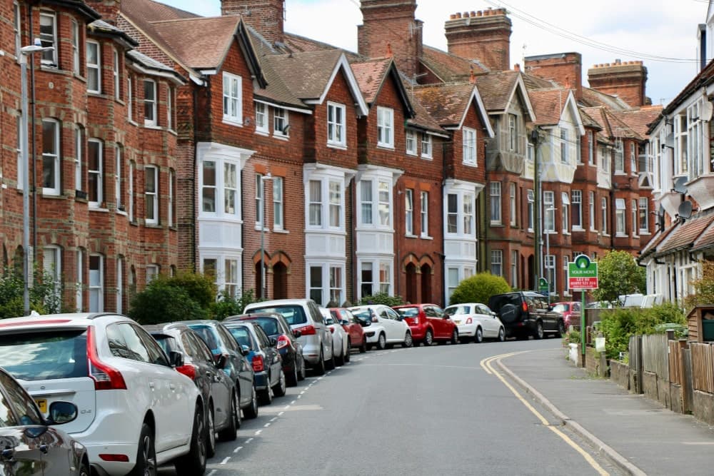 Cars parked on a busy residential road